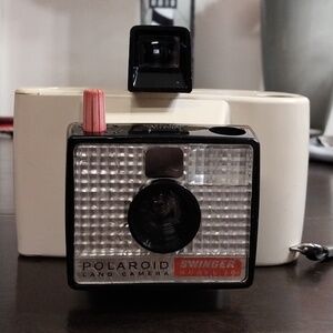 Polaroid White and Black Instant Land Camera with Orange Shutter Accent